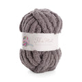 Pelote de laine bouclée gris moyen, label “Fil de Miel” avec étiquette blanche entourant la moitié.